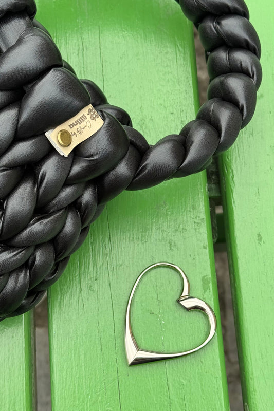 heart-shaped handbag hanger, silver purse hook, foldable bag hanger, rotatable handbag hook, compact purse holder, elegant bag accessory, portable handbag hook, anti-slip purse hanger, stylish handbag holder for table, durable silver bag hook, lightweight foldable purse hanger, heart design handbag accessory, travel-friendly handbag hook, chic purse hanger for women, practical handbag hook for everyday use, luxury silver handbag hanger, unique heart-shaped purse holder, handbag hook for restaurants and cafe